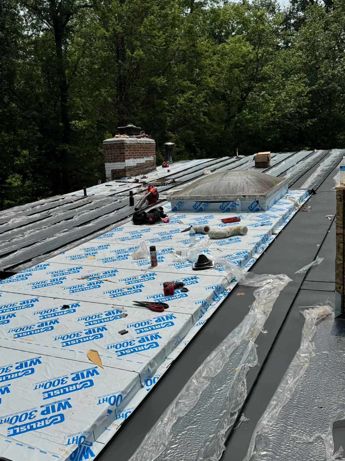Architectural metal roof install by United Developers